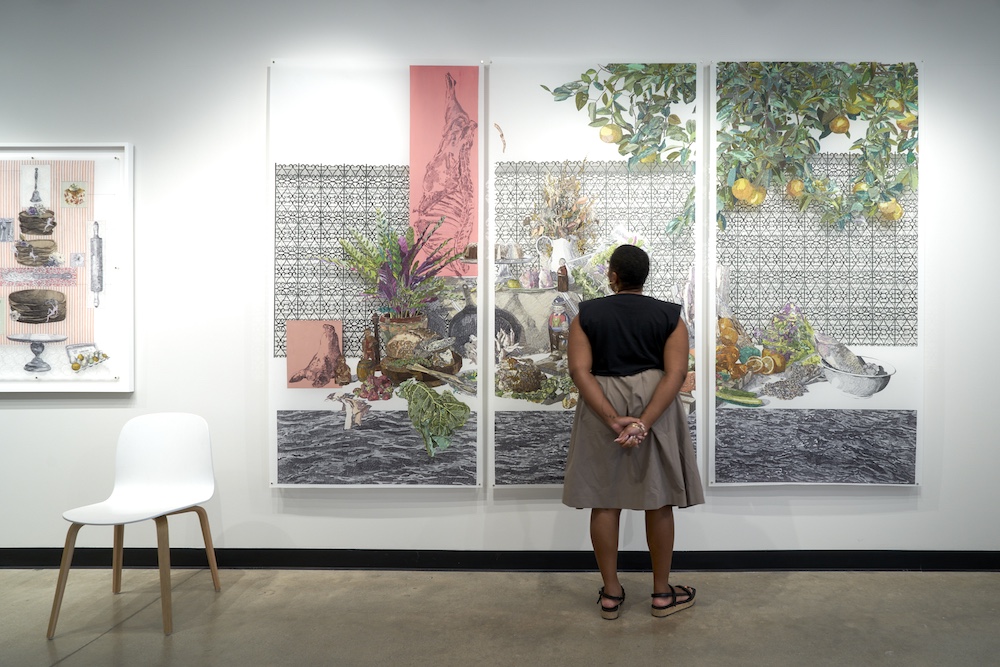 Laura Tanner standing in front of large scale art work.