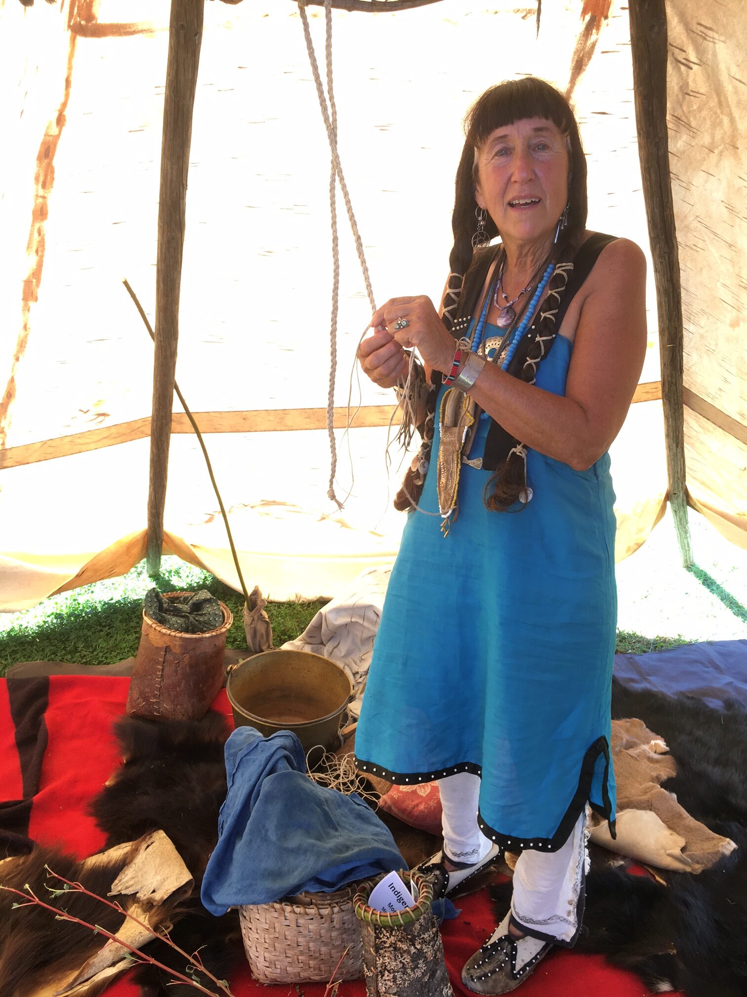 Jennifer Lee inside a wigwam.