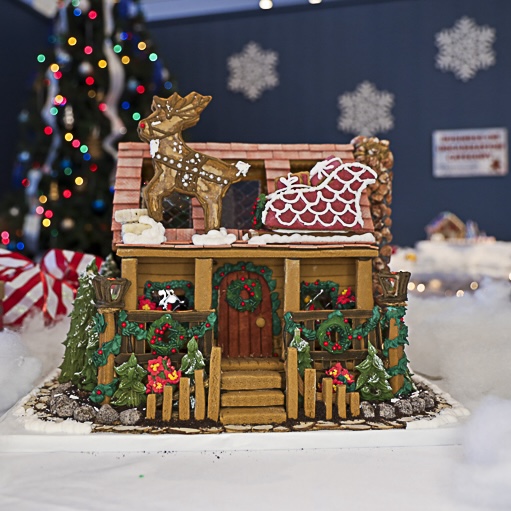 Red two-story Gingerbread House with many details
